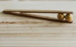 wooden plucker with two balls
