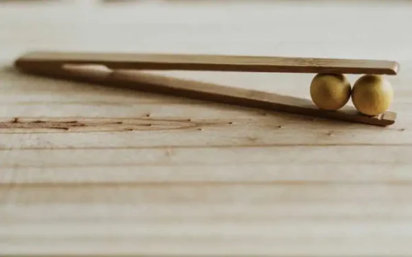 wooden plucker with two balls