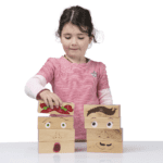 girl playing with block set