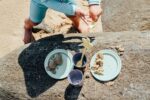 child playing on beach with sand