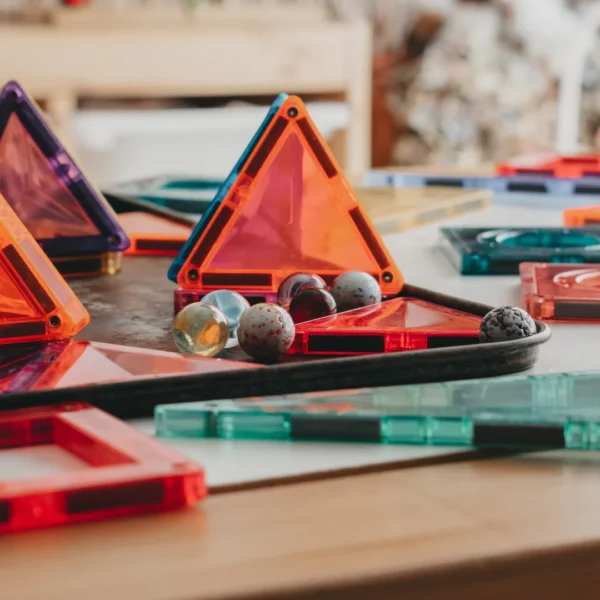 Tin of glass marbles 100+