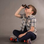 child playing with Binoculars