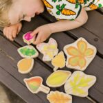 child playing with Stacking Leaves