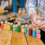 children playing with wooden dolls