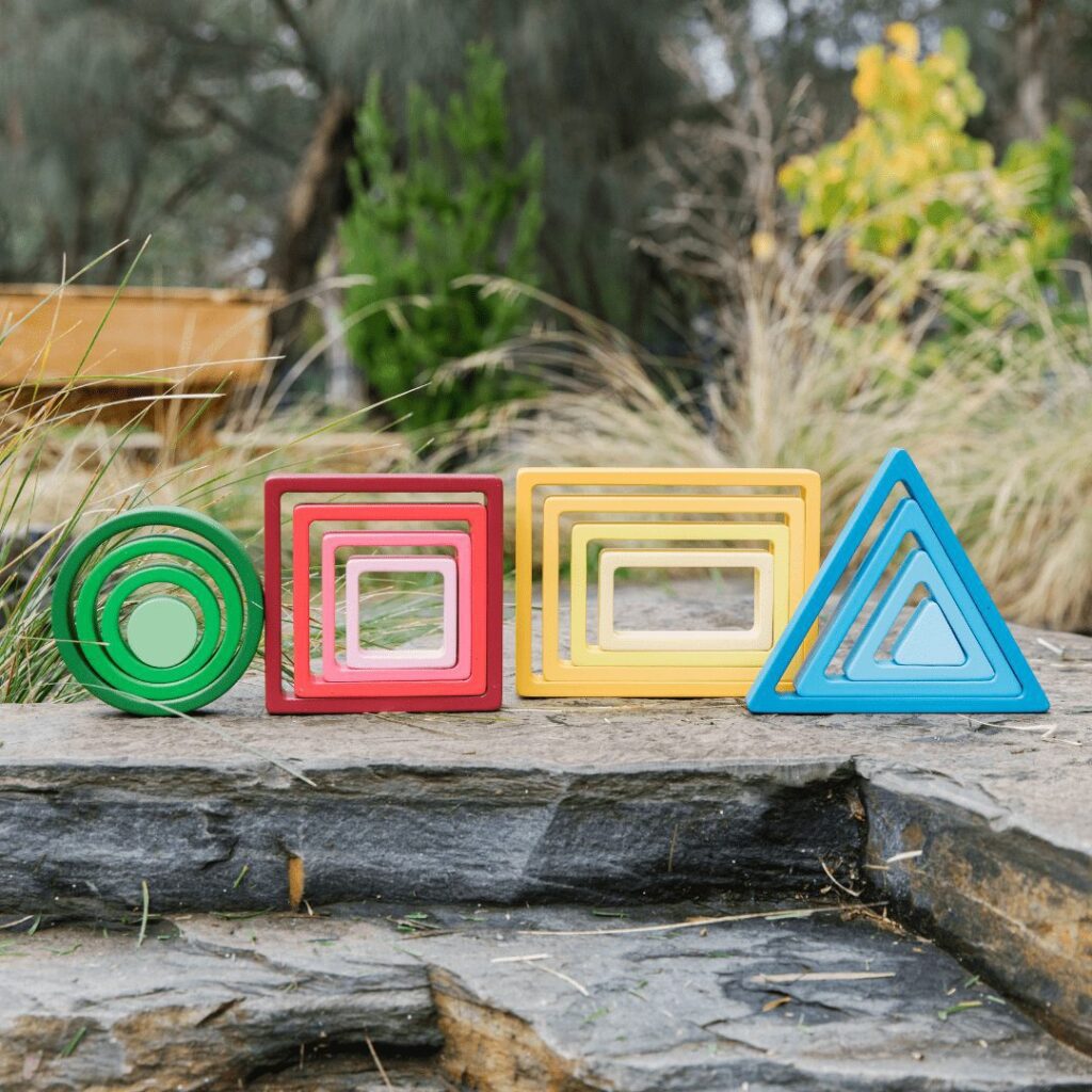 Stacking Rainbow Shape Blocks by Freckled Frog
